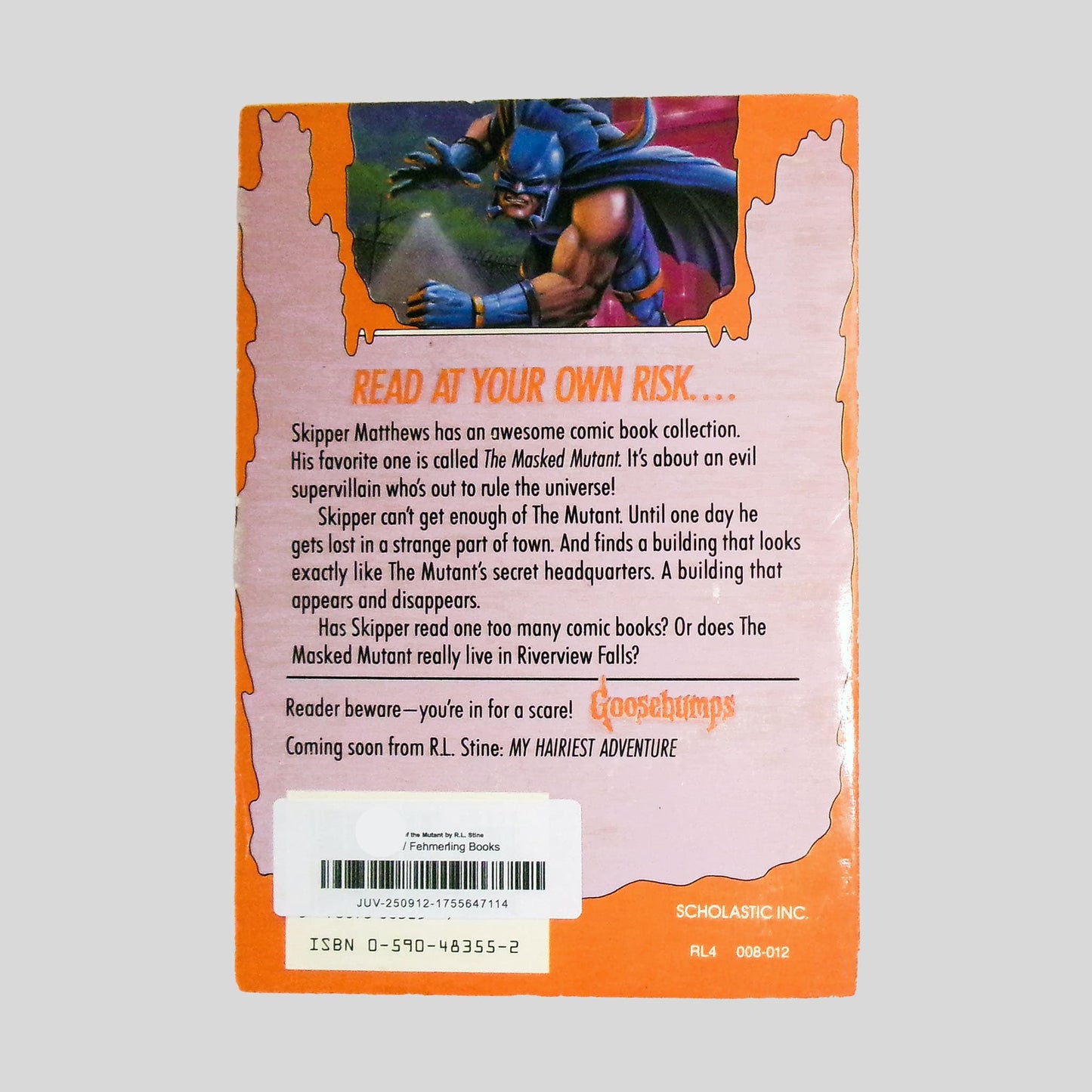 The back cover of the classic Goosebumps thriller 'Attack of the Mutant' by R.L. Stine. The screen features a bright orange, slime-dripping background with the ominous headline 'READ AT YOUR OWN RISK....'. This professional product shot captures the vibrant 90s horror aesthetic, detailing Skipper Matthews' quest into the villainous world of The Masked Mutant.