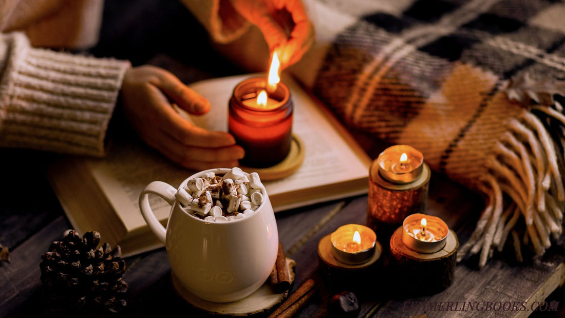 A cozy reading sancutary set up. Candles are being lit by someone wearing a comfy wool sweater with an open book and mug filled to the brim and a plaid, wool blanket.