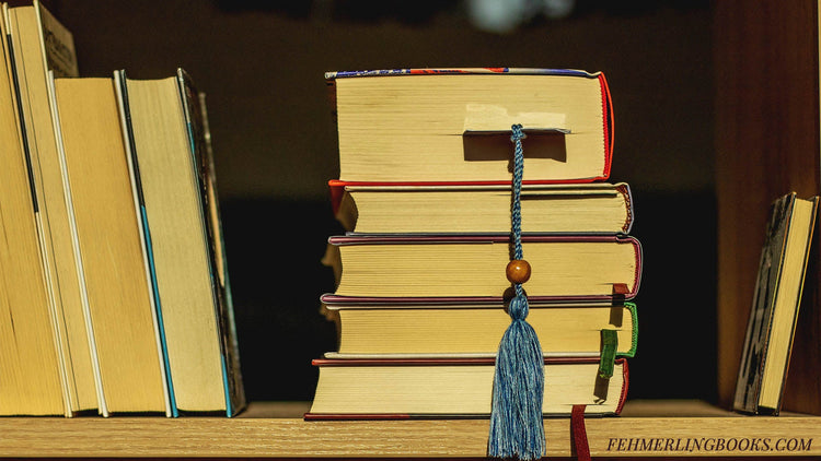 Sunlight on a stack of books with the top edges visible and various bookmarks tucked between pages.