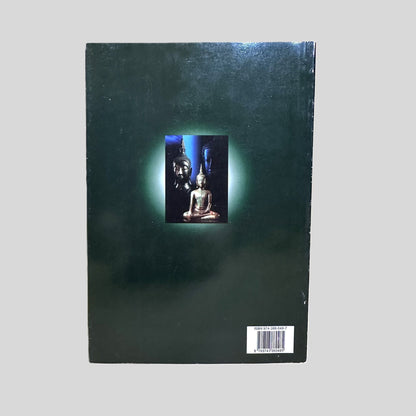 The back cover of 'Awakening: Monk Chat' published by the Academic Affairs of Mahachulalongkornrajavidyalaya Buddhist University in Chiang Mai, Thailand. The design features a minimalist dark green background with a central inset image of a golden Buddha statue glowing with a soft light. The lower right corner displays the ISBN 974-386-648-7, documenting the clean and well-preserved condition of this authentic monastic dialogue collection.