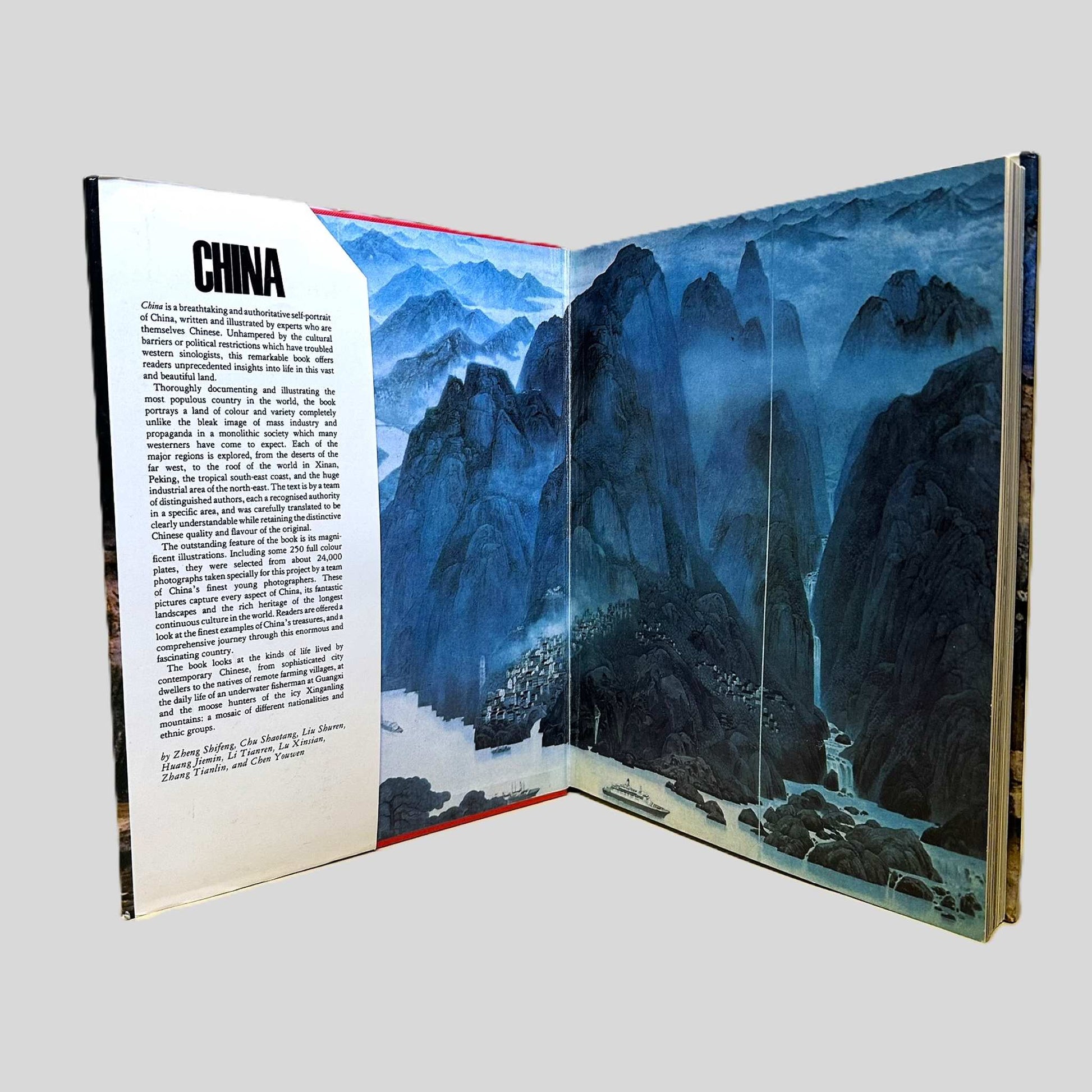 An internal view of the 1980 Gallery Books hardcover edition of 'China' by Zheng Shifeng, Liu Shuyuan, and others. The open book features a stunning multi-page gatefold displaying a panoramic Chinese landscape painting of misty blue mountains and verdant valleys. The left page provides a detailed introduction to this self-portrait of the nation, capturing the scale and beauty of the world's most populous country.