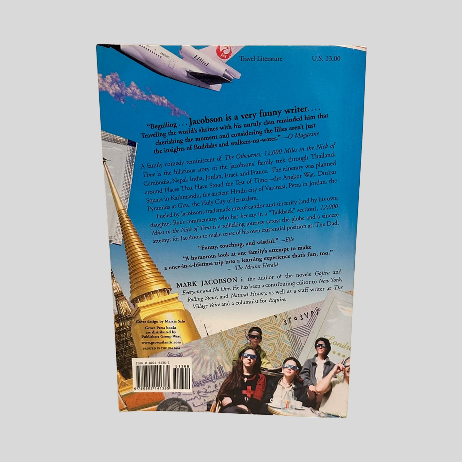 Back cover of the 12,000 Miles in the Nick of Time paperback by Mark Jacobson. The blue layout includes a detailed plot summary of the family's global adventure, critical praise, the Grove Press logo, and a clear barcode with ISBN 9780802141385.