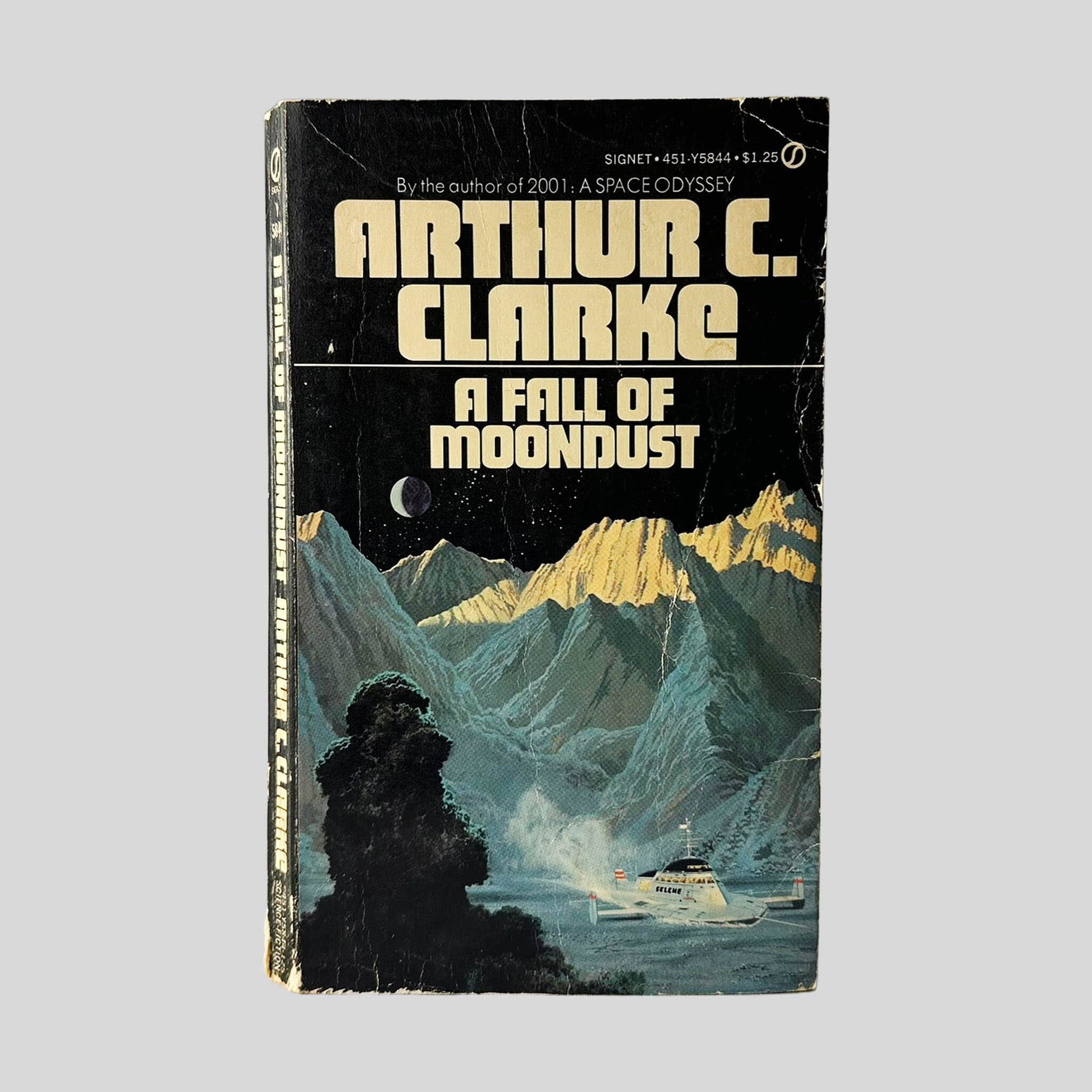 Front cover view of A Fall Of Moondust by Arthur C. Clarke centered on a neutral light gray background. Chipping and creasing are present.