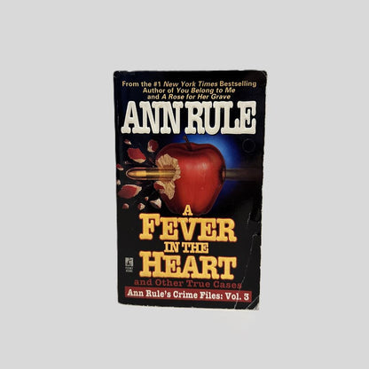 Front cover view of A Fever In The Heart by Ann Rule centered on a neutral light gray background. 