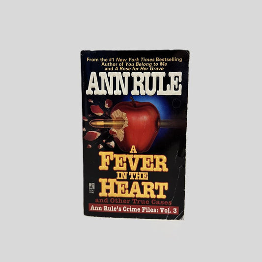 Front cover view of A Fever In The Heart by Ann Rule centered on a neutral light gray background. 