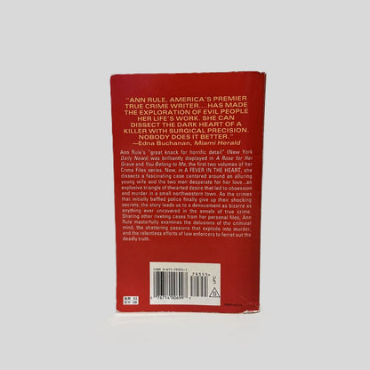 Back cover view of A Fever In The Heart by Ann Rule centered on a neutral light gray background. 
