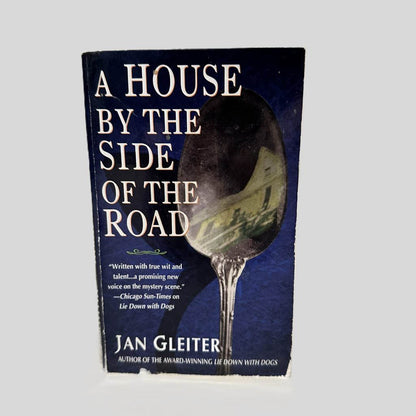 Front cover view of A House By The Side Of The Road by Jan Gleiter centered on a neutral light gray background. Front cover shows chipping along the bottom.