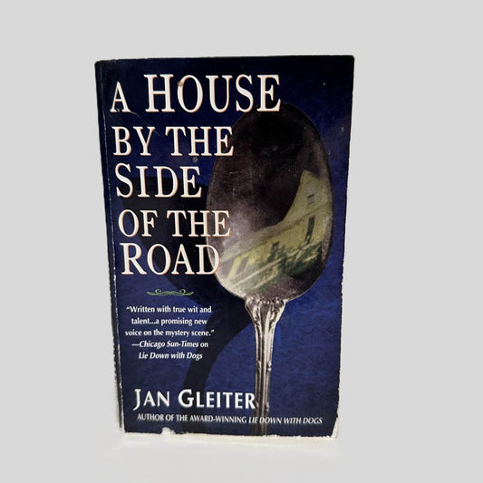 Front cover view of A House By The Side Of The Road by Jan Gleiter centered on a neutral light gray background. Front cover shows chipping along the bottom.