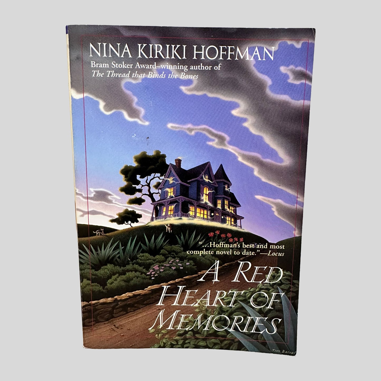 Front cover view of A Red Heart of Memories by Nina Kiriki Hoffman centered on a neutral light gray background. 