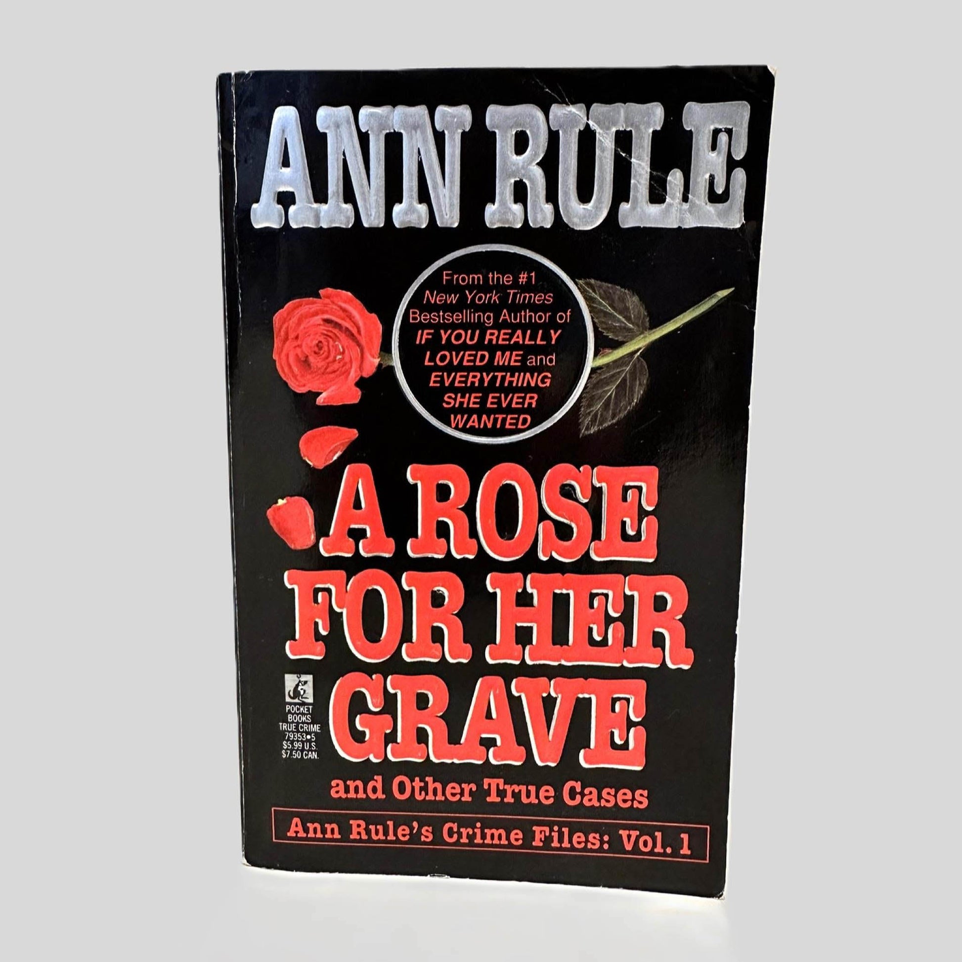 Front cover view of A Rose For Her Grave by Ann Rule centered on a neutral light gray background. 
