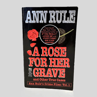 Front cover view of A Rose For Her Grave by Ann Rule centered on a neutral light gray background. 
