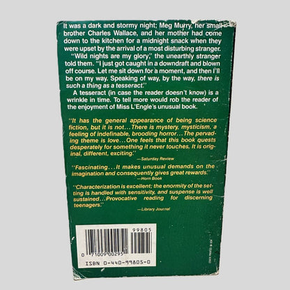 Back cover view of A Wrinkle in Time by Madeleine L'Engle centered on a neutral light gray background. Chipping in the top right corner of the spine and bottom left corner. Creasing is also present near the spine edge.