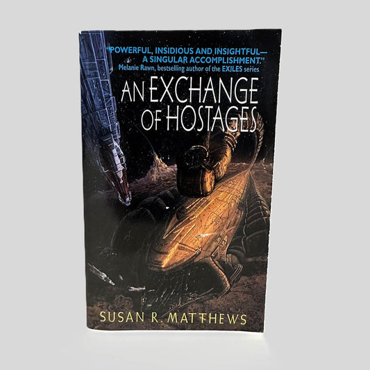 Front cover view of An Exchange of Hostages by Susan R. Matthews centered on a neutral light gray background. 