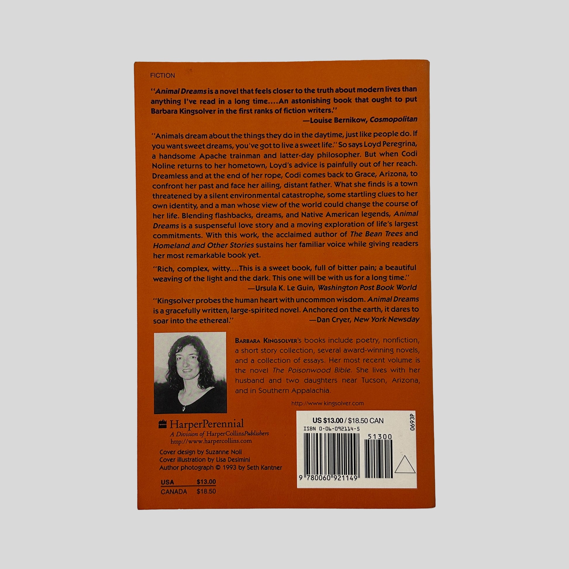 The orange back cover of Animal Dreams, displaying critical praise from the Washington Post and Cosmopolitan, a plot summary, and a black-and-white author photograph of Barbara Kingsolver.