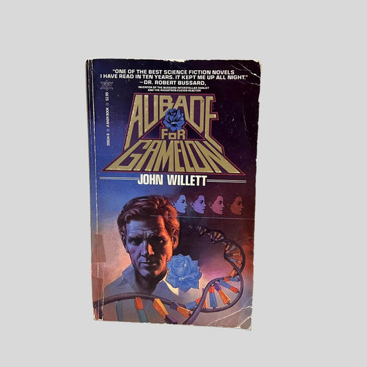 Front cover view of Aubade for Gamelon by John Willett centered on a neutral light gray background. Chipping and creasing are present around the edges and corners. Cover art is vibrant.