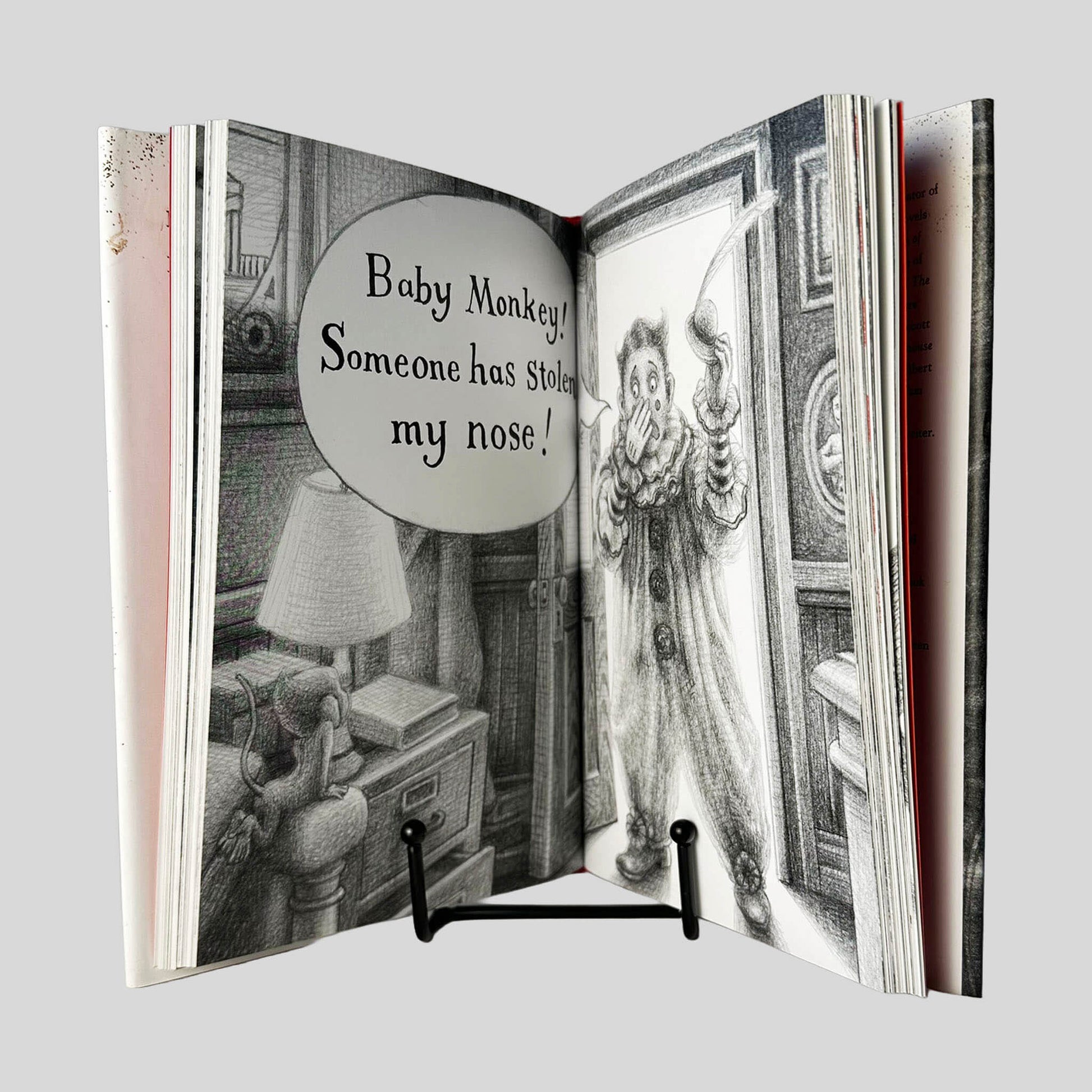 Inside page view of Baby Monkey, Private Eye by Brian Selznick & David Serlin centered on a neutral light gray background. Pages are tight and crisp.