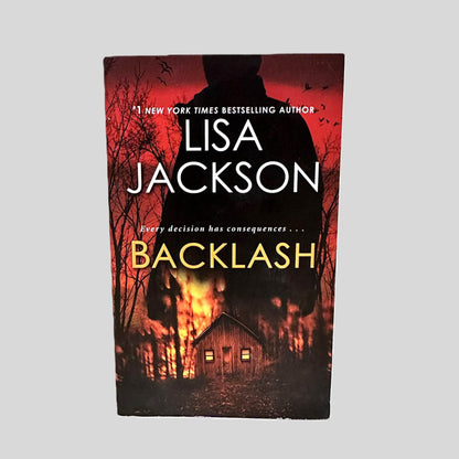 Front cover view of Backlash by Lisa Jackson centered on a neutral light gray background. 