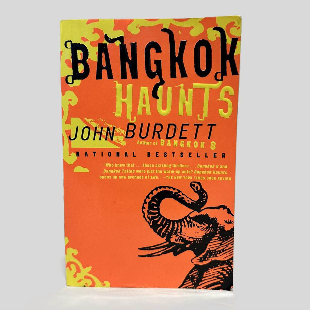 Front cover view of Bangkok Haunts by John Burdett centered on a neutral light gray background. Chipping in the corners.
