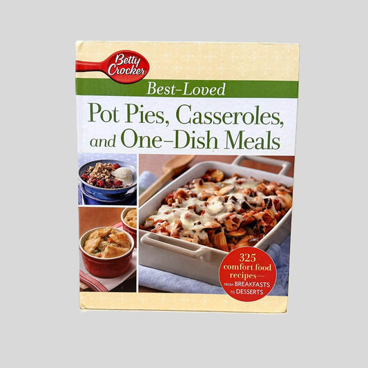 Front cover view of Betty Crocker Best-Loved Pot Pies, Casseroles, and One-Dish Meals centered on a neutral light gray background. Bumping is present.