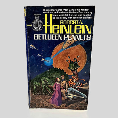 Front cover view of  Between Planets by Robert A. Heinlein centered on a neutral light gray background. Creasing near the spine. Chipping from age and wear around the edges. Cover art is vibrant.