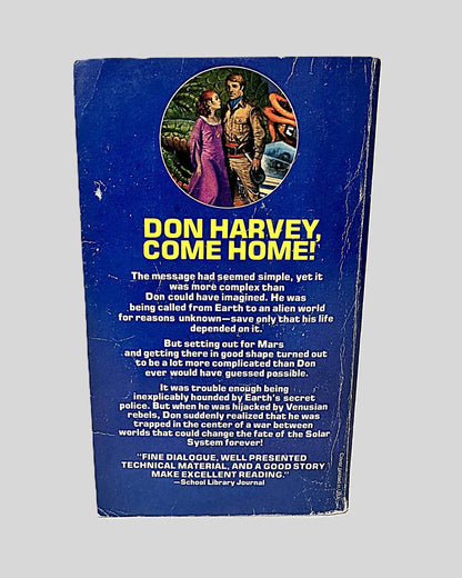 Back cover view of Between Planets by Robert A. Heinlein centered on a neutral light gray background. Creasing and chipping from wear are present around the edges and near the spine.