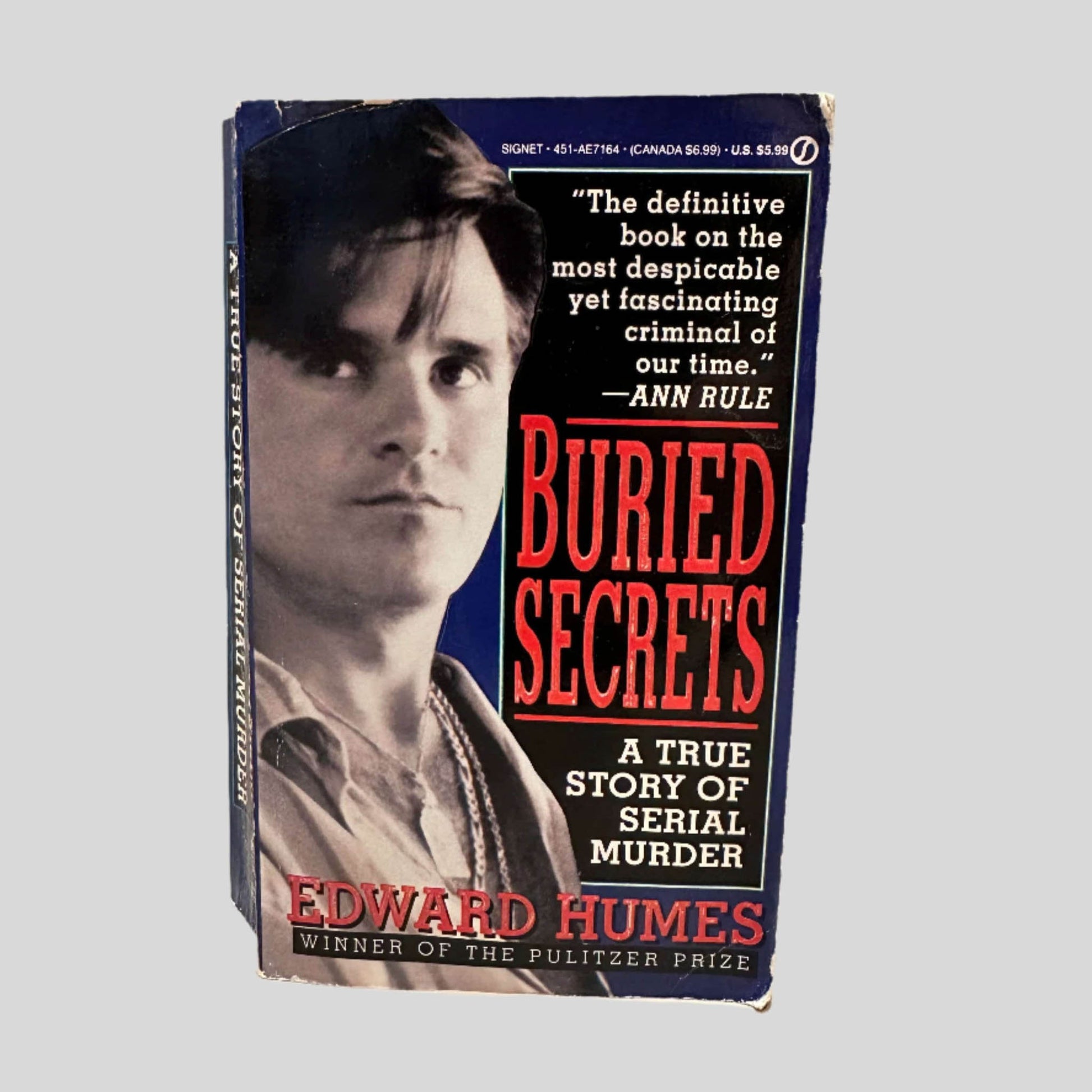 Front cover view of Buried Secrets by Edward Humes centered on a neutral light gray background. 