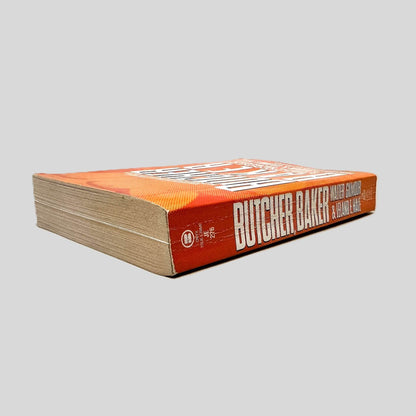 Close-up spine view of Butcher, Baker by Walter Gilmour & Leland E. Hale centered on a neutral light gray background. Spine is square, shows creasing.