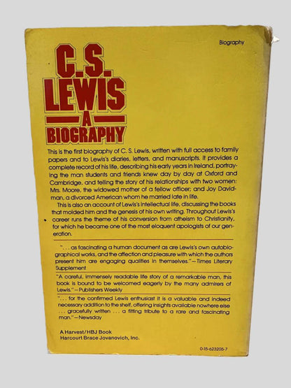 Back cover view of C.S. Lewis A Biography by Roger Lancelyn Green & Walter Hooper centered on a neutral light gray background. Chipping along the edges and corners.