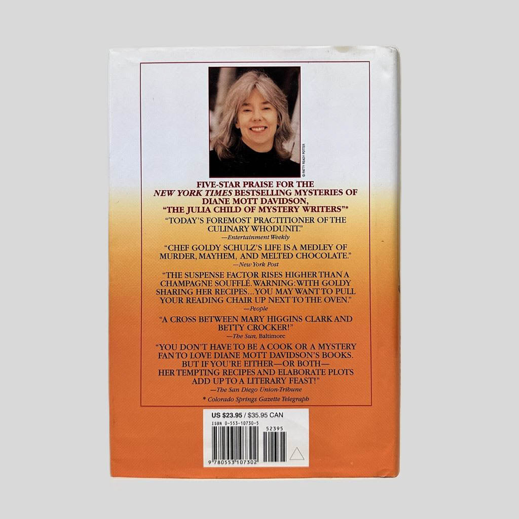 Back cover view of Chopping Spree by Diane Mott Davidson centered on a neutral light gray background. Dust jacket is present and undamaged.