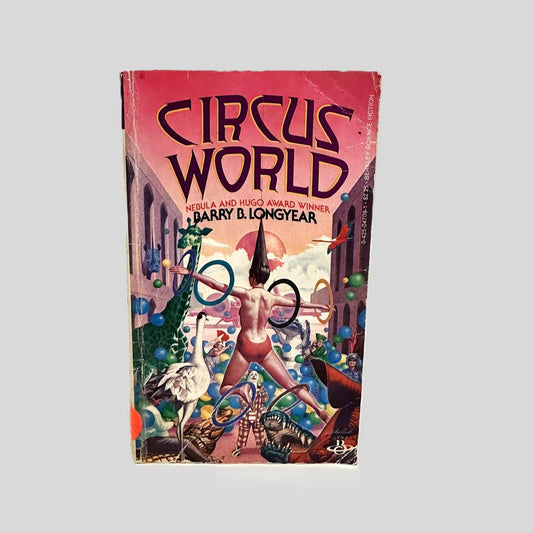 Front cover view of Circus World by Barry B. Longyear centered on a neutral light gray background. Chipping and creasing are present around the edges.