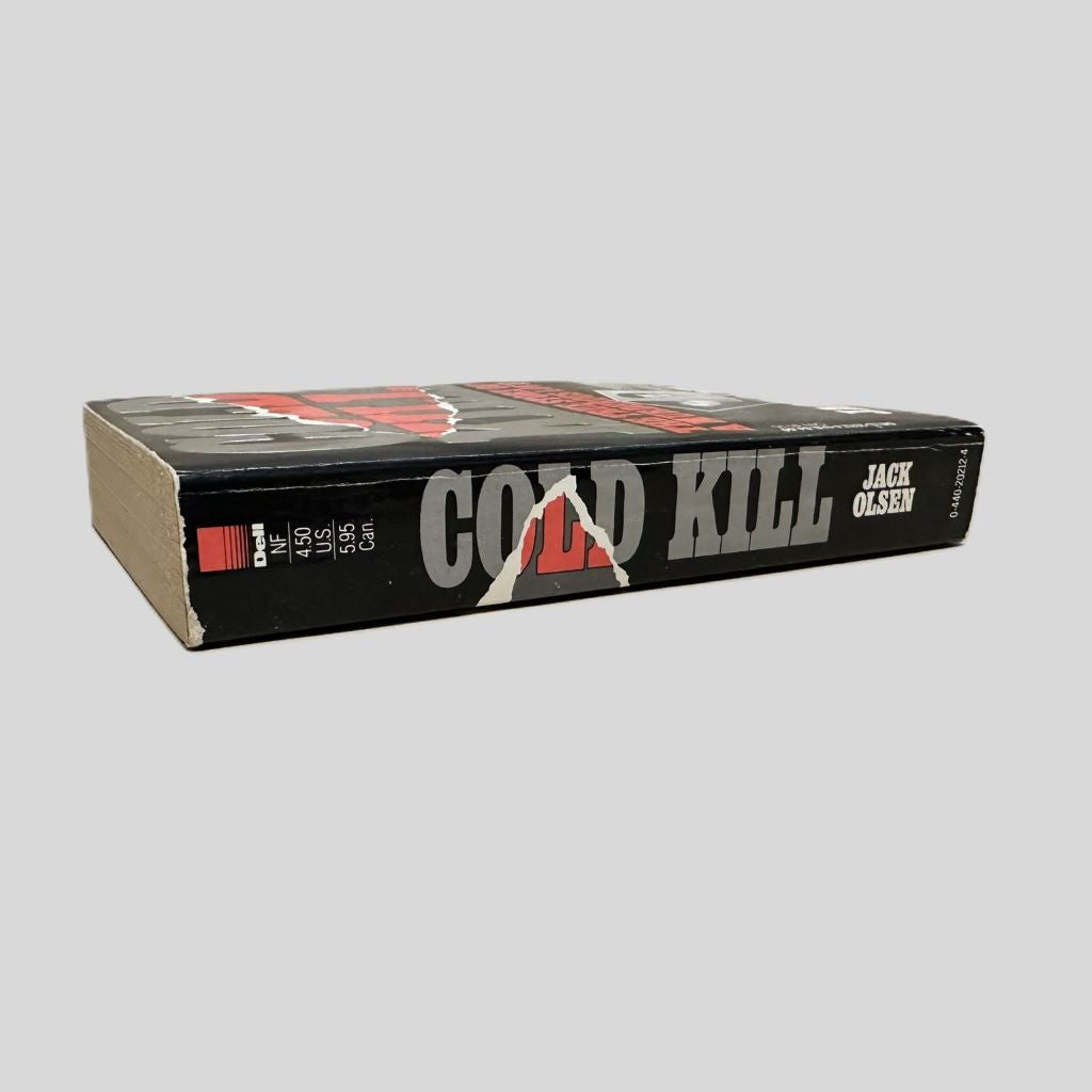 Close-up spine view of Cold Kill by Jack Olsen centered on a neutral light gray background. Spine shows creasing and bumping.