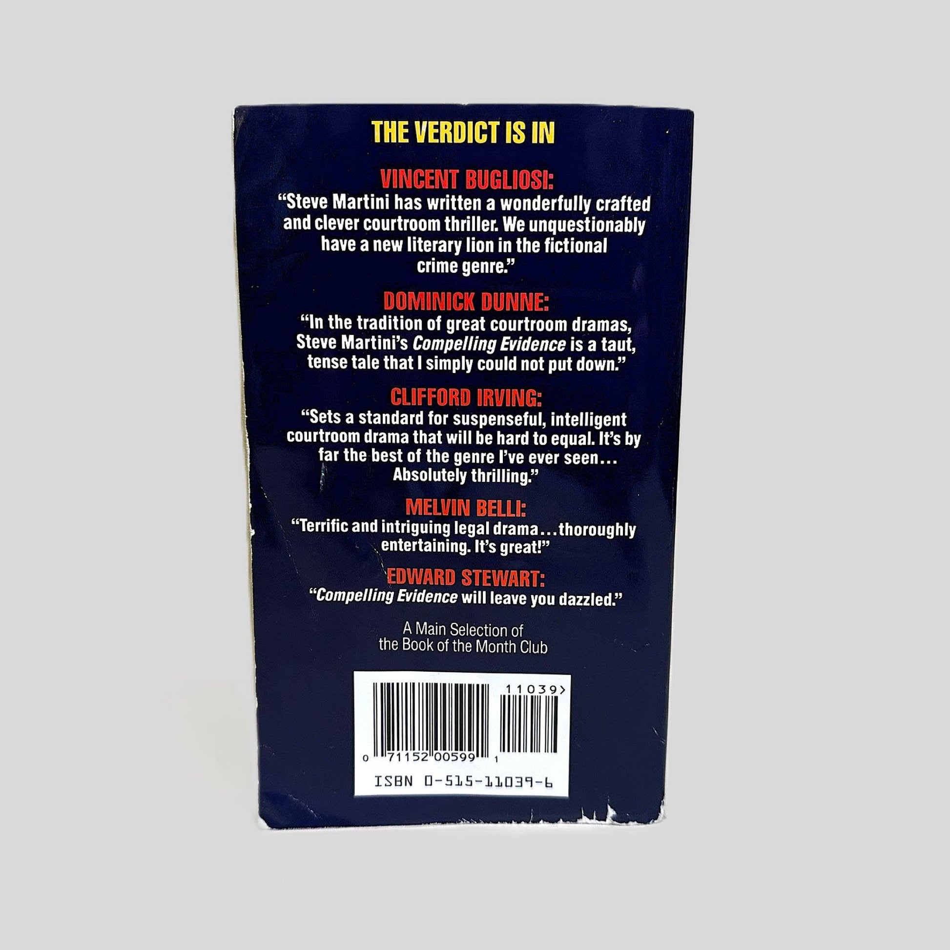 Back cover view of Compelling Evidence by Steve Martini centered on a neutral light gray background. 