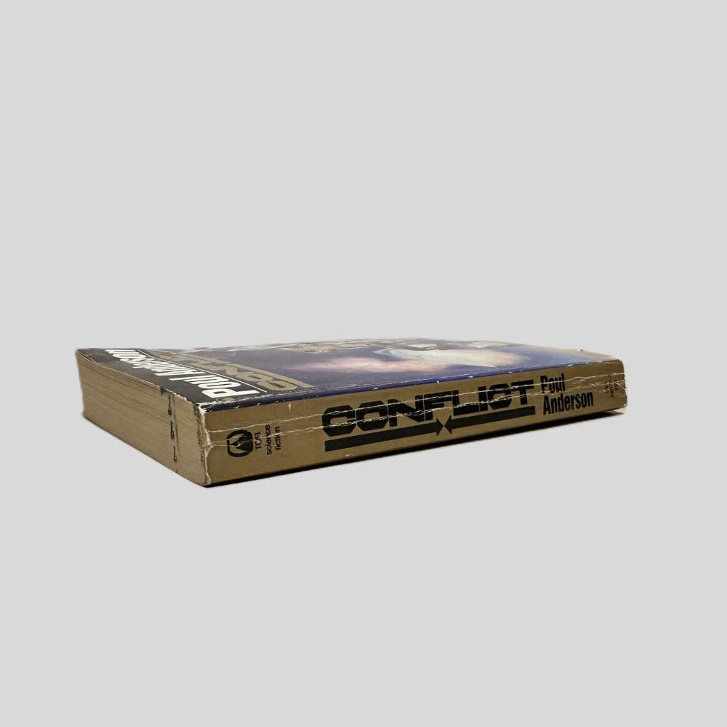 Close-up spine view of Conflict by Poul Anderson centered on a neutral light gray background. Spine shows chipping and  minimal creasing. Spine is square. Pages lay flat.