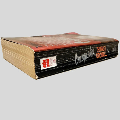 Close-up spine view of Crazymaker by Thomas J. O'Donnell centered on a neutral light gray background. Spine shows creasing and chipping.