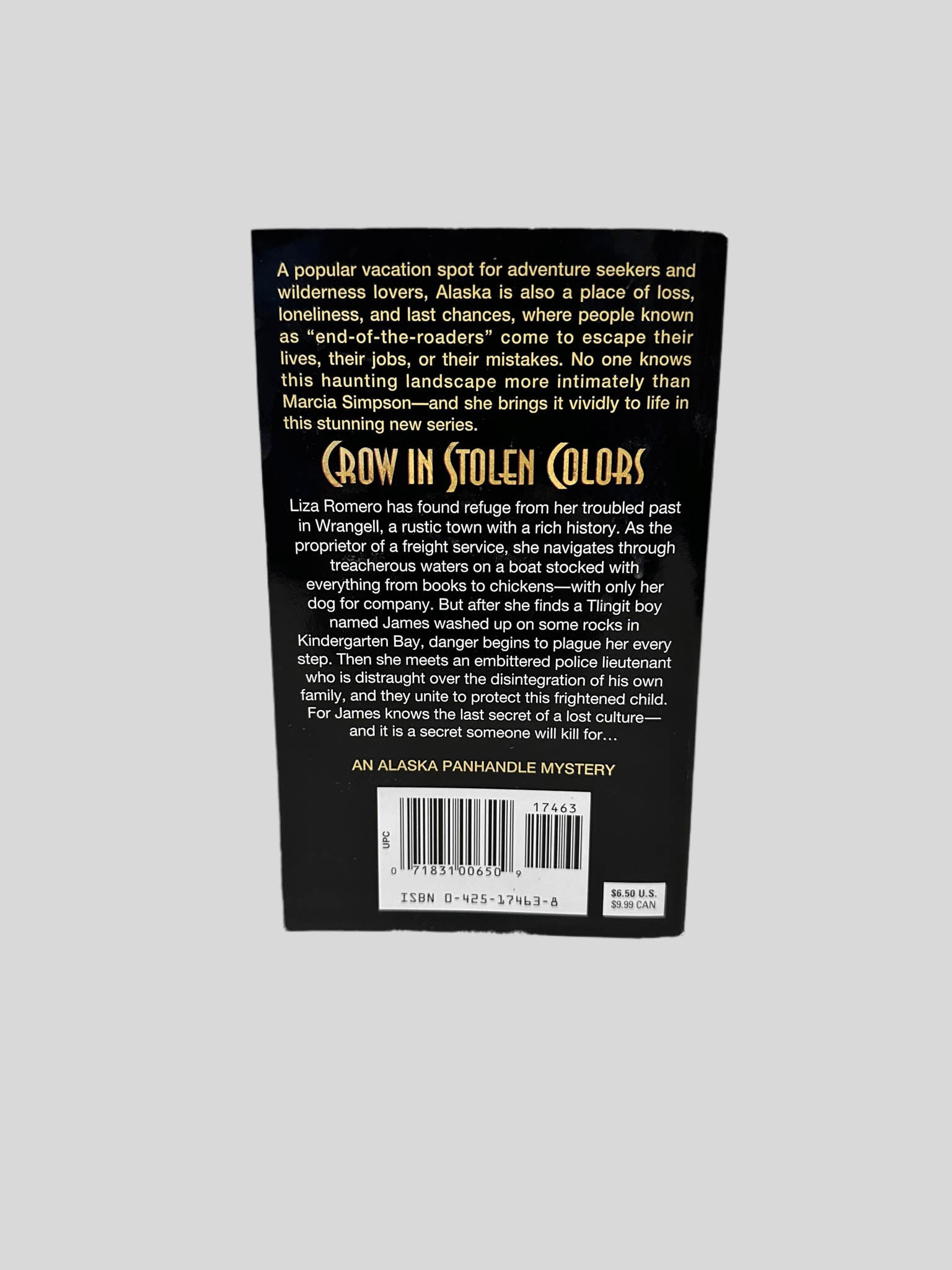 Back cover view of Crow in Stolen Colors (Autographed Copy) by Marcia Simpson centered on a neutral light gray background. 