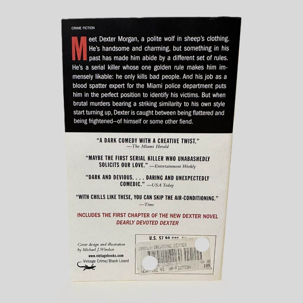 Back cover view of Darkly Dreaming Dexter by Jeff Lindsay centered on a neutral light gray background. 