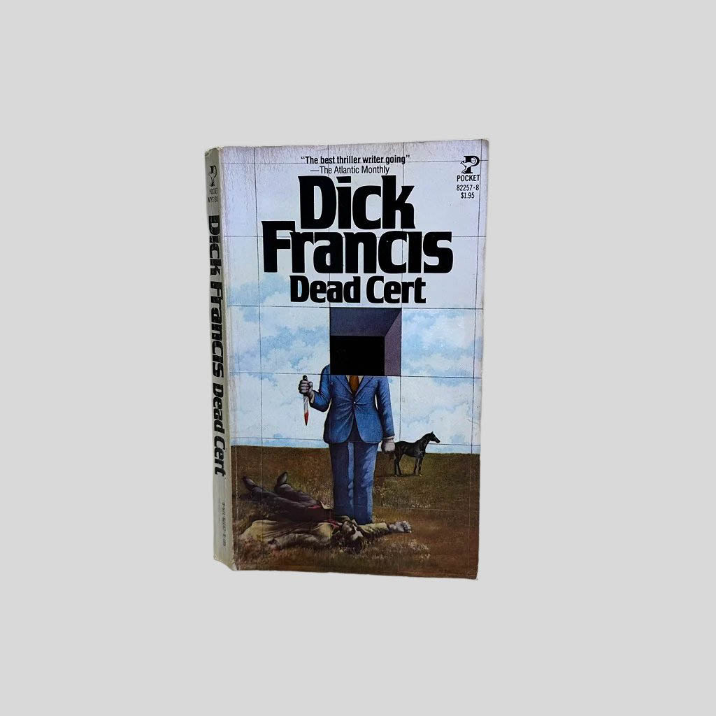 Front cover view of Dead Cert by Dick Francis centered on a neutral light gray background. Cover shows chipping from age.