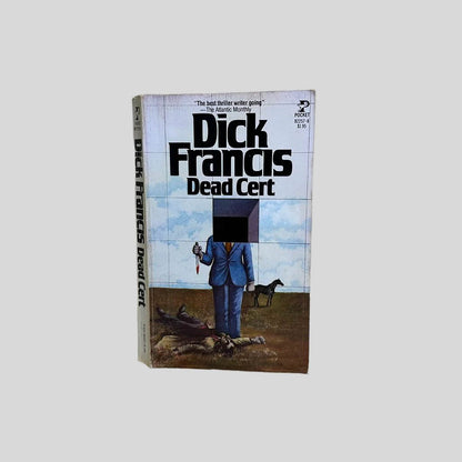 Front cover view of Dead Cert by Dick Francis centered on a neutral light gray background. Cover shows chipping from age.