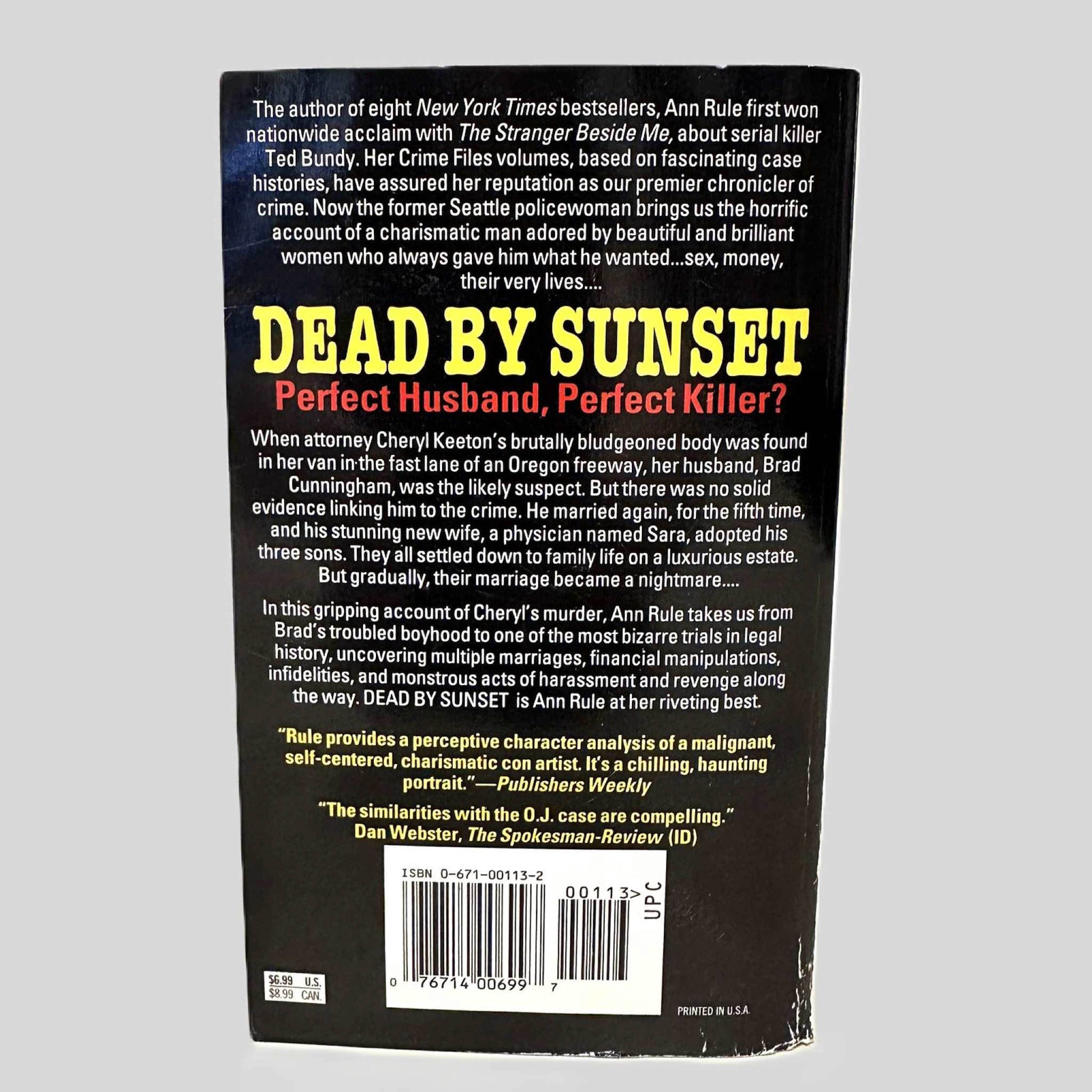 Back cover view of Dead by Sunset by Ann Rule centered on a neutral light gray background. 