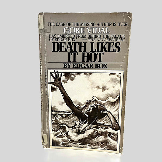 Front cover view of Death Likes It Hot by Edgar Box centered on a neutral light gray background. Cover shows creasing and chipping. 