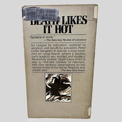 Back cover view of Death Likes It Hot by Edgar Box centered on a neutral light gray background. Back cover shows chipping around the edges. There is a library barcode sticker in the top corner, colored over with black marker.