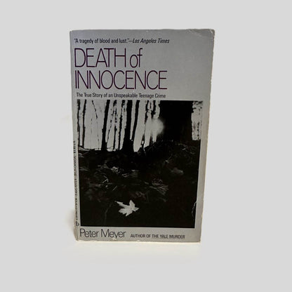 Front cover view of Close-up spine view of Death of Innocence by Pete Meyer centered on a neutral light gray background. 
