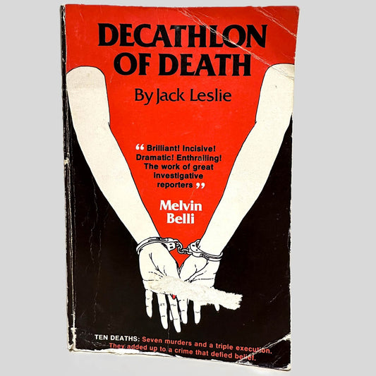 Front cover view of Decathlon of Death by Jack Leslie centered on a neutral light gray background. Cover shows creasing and rubbing.