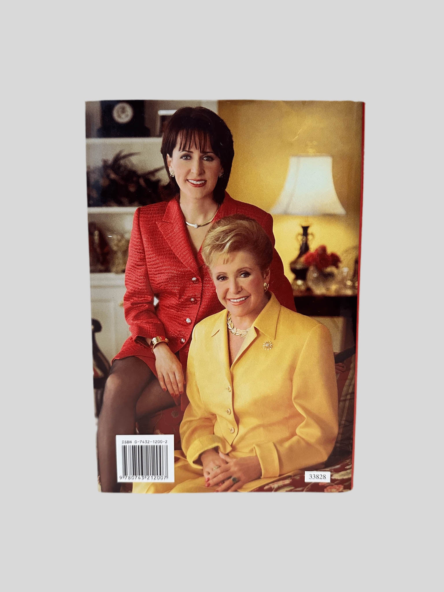 Back cover view of Deck the Halls by Mary & Carol Higgins Clark centered on a neutral light gray background. Dust jacket is present and undamaged. 