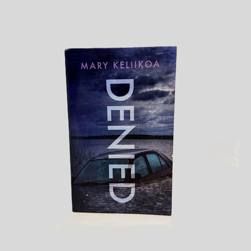 Front cover view of Denied by Mary Keliikoa centered on a neutral light gray background. 