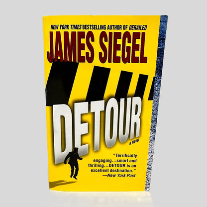Front cover view of Detour by James Siegel centered on a neutral light gray background. Cover shows no damage.
