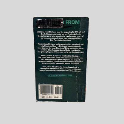 Back cover view of Dilvish, the Damned by Roger Zelazny centered on a neutral light gray background. Chipping around the edges and the left side corners from wear. Creasing near the spine edge. Library barcode sticker in the top left corner, colored over with black ink. 
