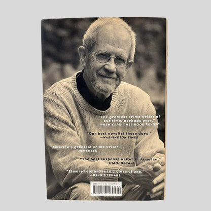 Back cover view of Djibouti by Elmore Leonard centered on a neutral light gray background. 