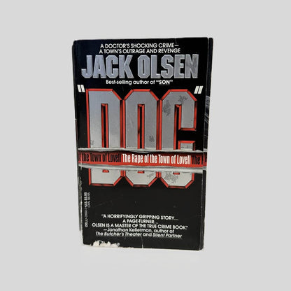 Front cover view of Doc by Jack Olsen centered on a neutral light gray background. 