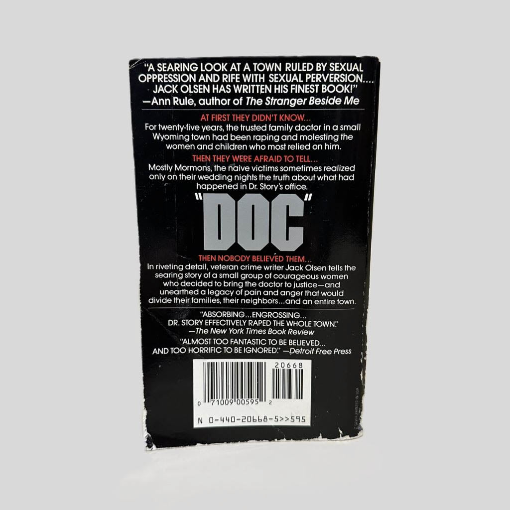 Back cover view of Doc by Jack Olsen centered on a neutral light gray background. 